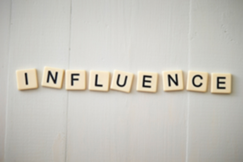 Letters spell out the word Influence.