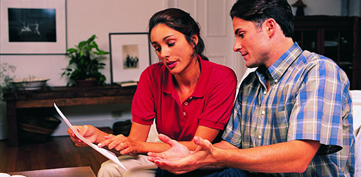 woman and man reviewing paper